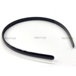 stack-of-black-slim-glossy-plastic-headbands-with-teeth-for-grip