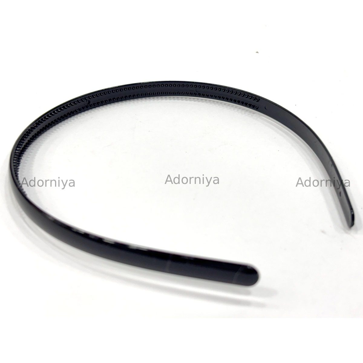 stack-of-black-slim-glossy-plastic-headbands-with-teeth-for-grip